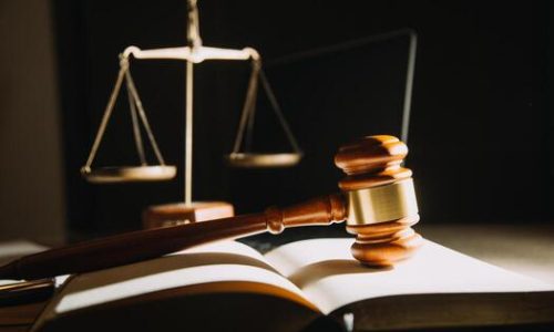 business-and-lawyers-discussing-contract-papers-with-brass-scale-on-desk-in-office-law-legal-services-advice-justice-and-law-concept-picture-with-film-grain-effect-free-photo